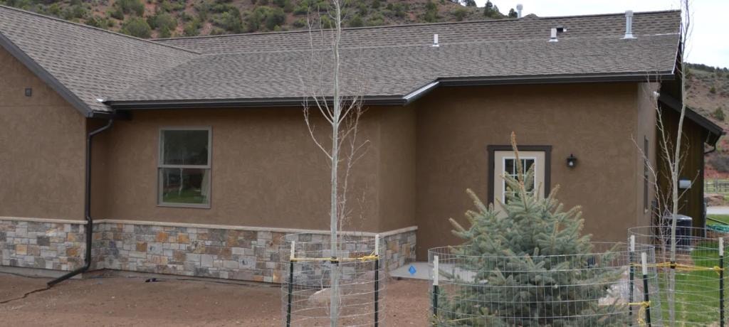 Modern ranch house with stone foundation