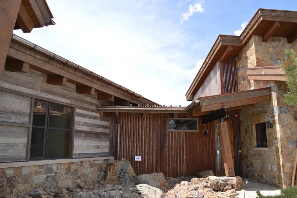 Rustic home with stone and wood architecture
