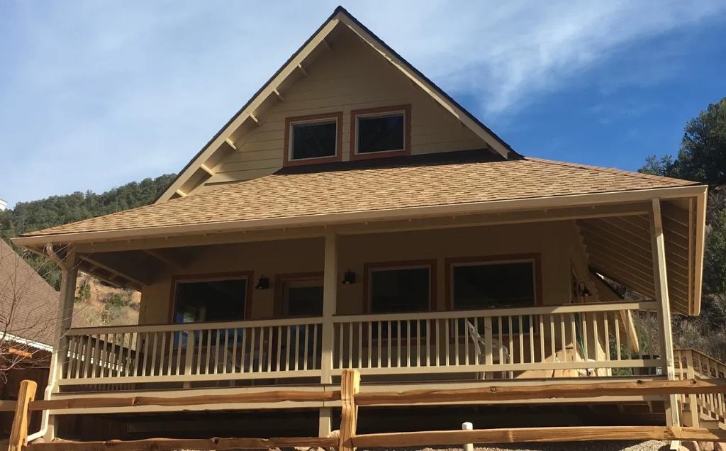 Craftsman home with covered porch and gutter system